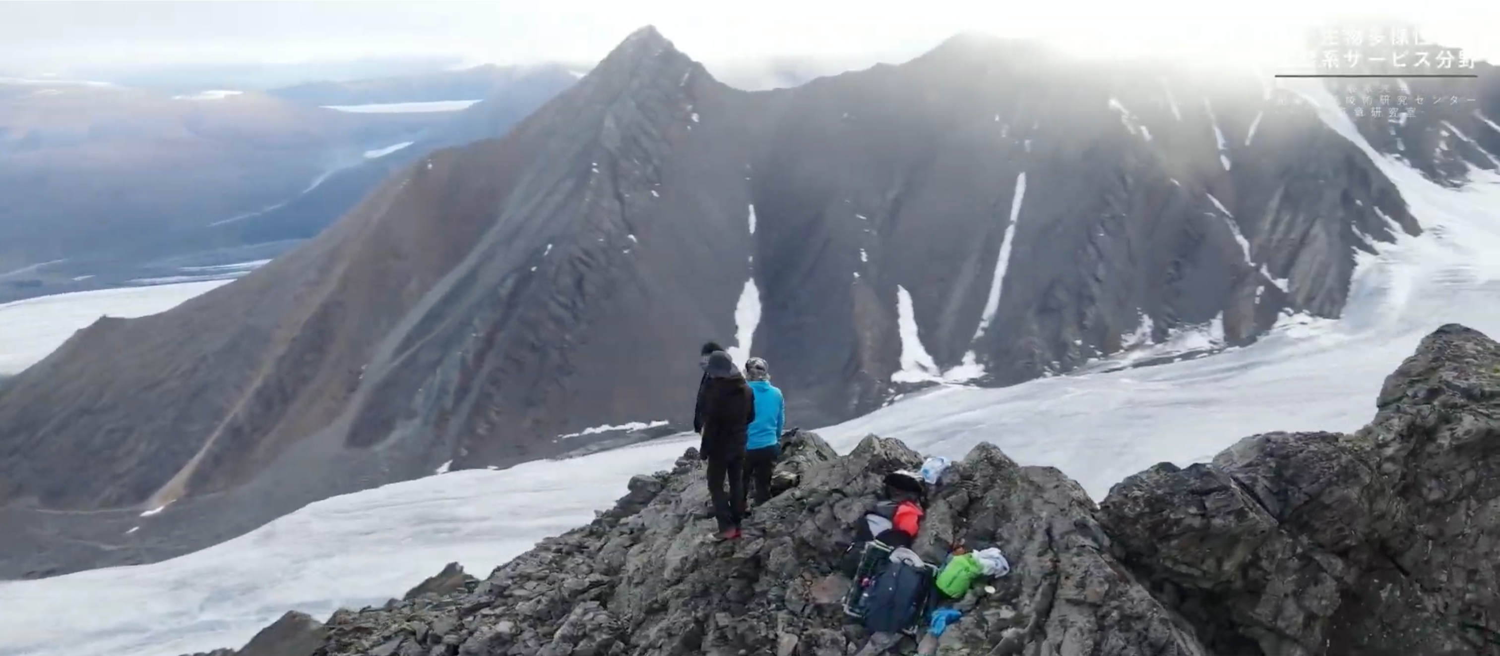 Research team on a ridge above a glacier in the Krieger Mountains, Ellesmere Island